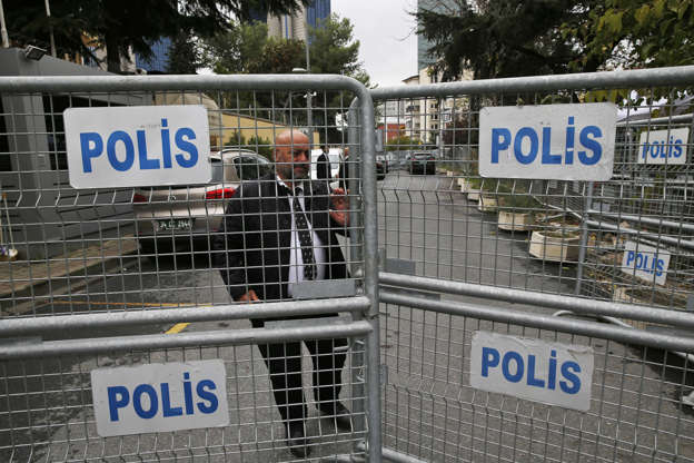 Slide 4 of 53: A security guard stands behind barriers blocking the road leading to the Saudi Arabia consulate in Istanbul, Thursday, Oct. 18, 2018.