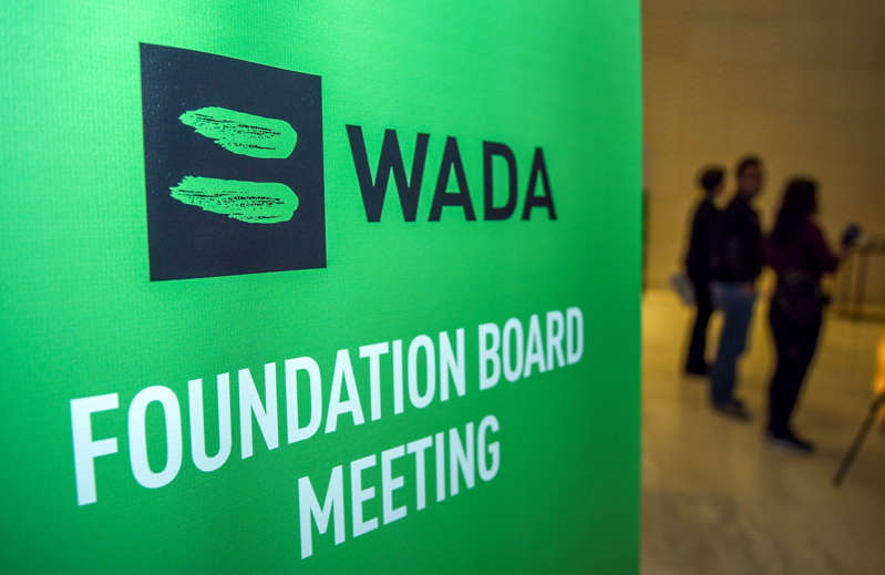 Journalists stands in the lobby of the World Anti-Doping Agency (WADA) foundation board in Baku on November 15, 2018. 