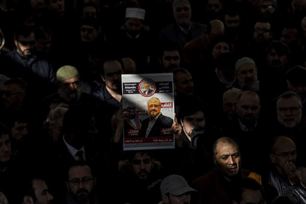 Slide 3 of 67: A person holds a banner of Jamal Khashoggi during a symbolic funeral prayer for the Saudi journalist, killed and dismembered in the Saudi consulate in Istanbul in October, at the courtyard of Fatih mosque in Istanbul, on November 16, 2018. - Turkey has more evidence contradicting the Saudi version of the murder of journalist Jamal Khashoggi including a second audio recording, revealing that the murder had been premeditated, a Turkish newspaper reported on November 16, a contradiction to the statement of the Saudi prosecutor who said that five Saudi officials faced the death penalty on charges of killing Khashoggi but exonerated the country