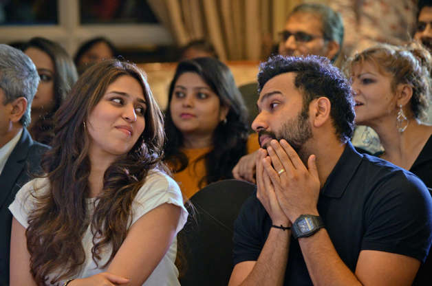 35 में से 12 स्लाइड: Indian cricketer Rohit Sharma shares a moment with his wife Ritika Sajdeh during the book launch event of 'A century is not enough' written by Sourav Ganguly himself at Bandra, on April 4, 2018 in Mumbai, India.