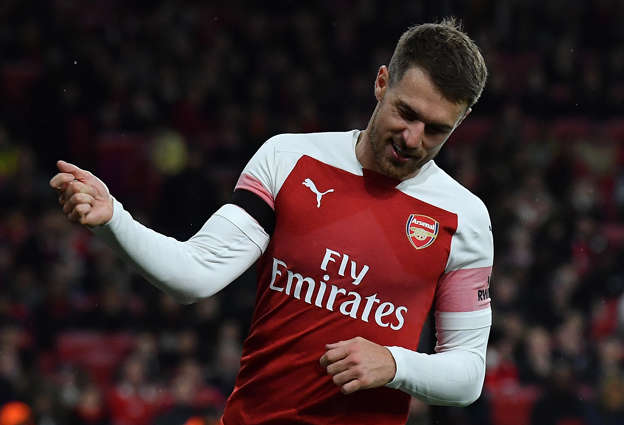 Arsenal's Welsh midfielder Aaron Ramsey reacts after failing to score during the English League Cup football match between West Ham United and Tottenham Hotspur at The London Stadium, in east London on October 31, 2018. (Photo by Ben STANSALL / AFP) / RESTRICTED TO EDITORIAL USE. No use with unauthorized audio, video, data, fixture lists, club/league logos or 'live' services. Online in-match use limited to 120 images. An additional 40 images may be used in extra time. No video emulation. Social media in-match use limited to 120 images. An additional 40 images may be used in extra time. No use in betting publications, games or single club/league/player publications. /         (Photo credit should read BEN STANSALL/AFP/Getty Images)