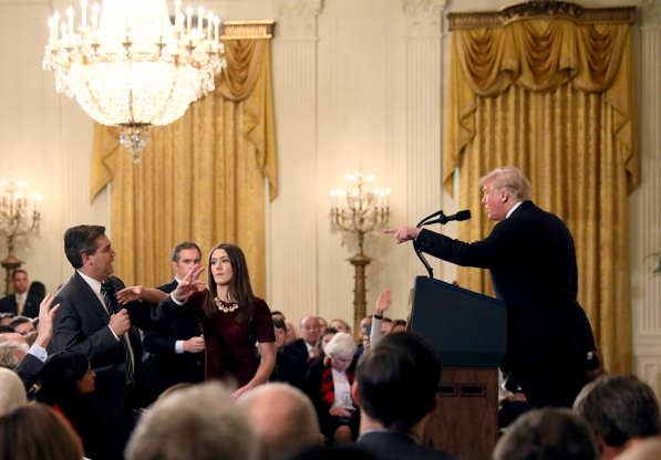 Slide 2 of 29: A White House staff member reaches for the microphone held by CNN's Jim Acosta as he questions U.S. President Donald Trump during a news conference following Tuesday's midterm U.S. congressional elections at the White House in Washington, U.S., November 7, 2018.