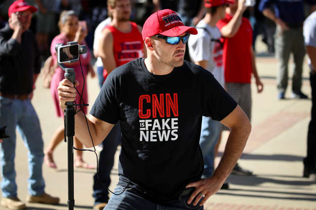Slide 4 of 29: A Trump supporter wears a "CNN is fake news" t-shirt at a “Turn California Red” rally that drew a small crowd of anti-fascist counter-protesters in Sacramento, California, U.S. November 4, 2018.