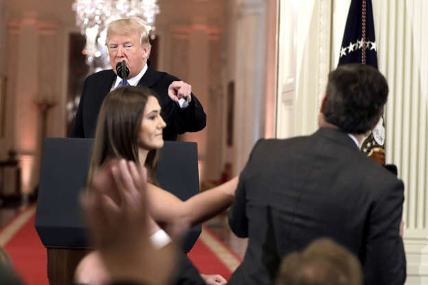Slide 3 of 29: As President Donald Trump points to CNN's Jim Acosta, a White House aide takes the microphone from him during a news conference in the East Room of the White House, Wednesday, Nov. 7, 2018, in Washington.