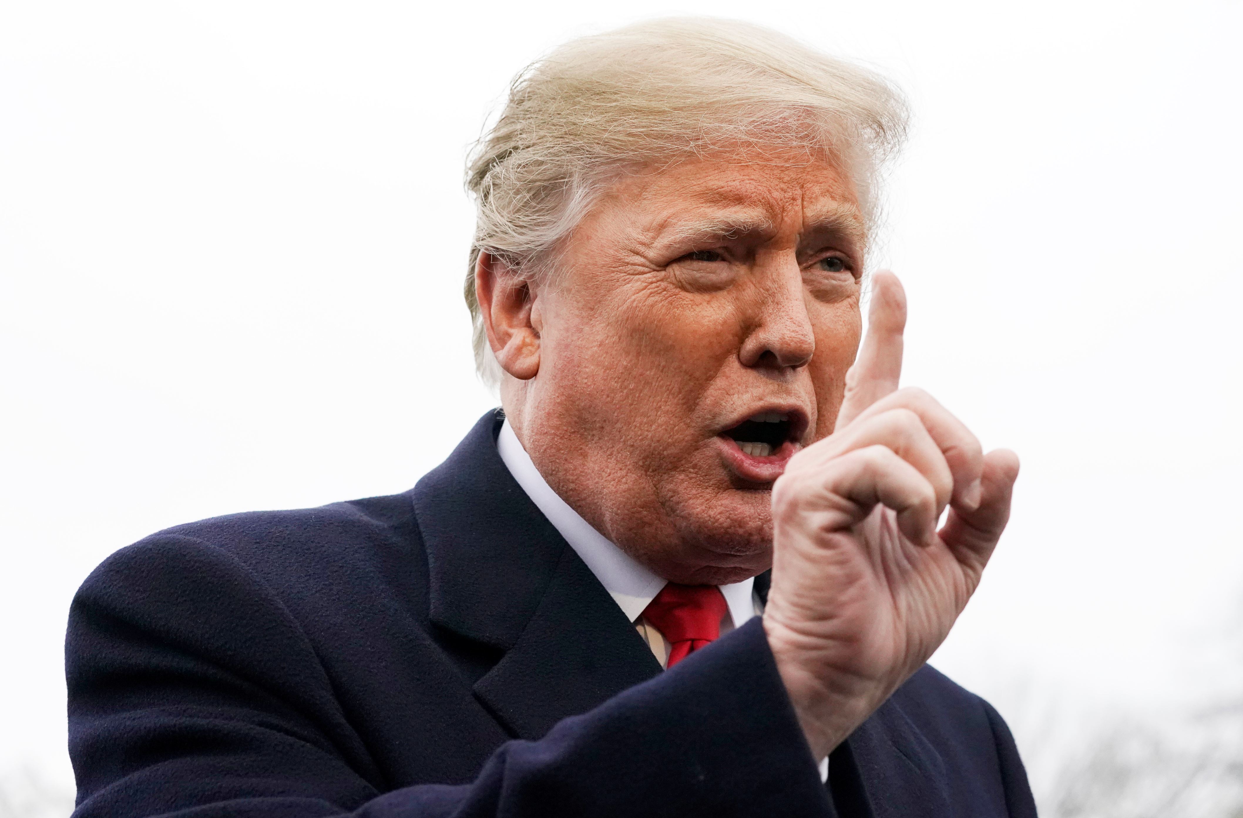 U.S. President Donald Trump answers a question from a reporter as he departs the White House for travel to Mississippi in Washington, U.S. November 26, 2018.  REUTERS/Jonathan Ernst