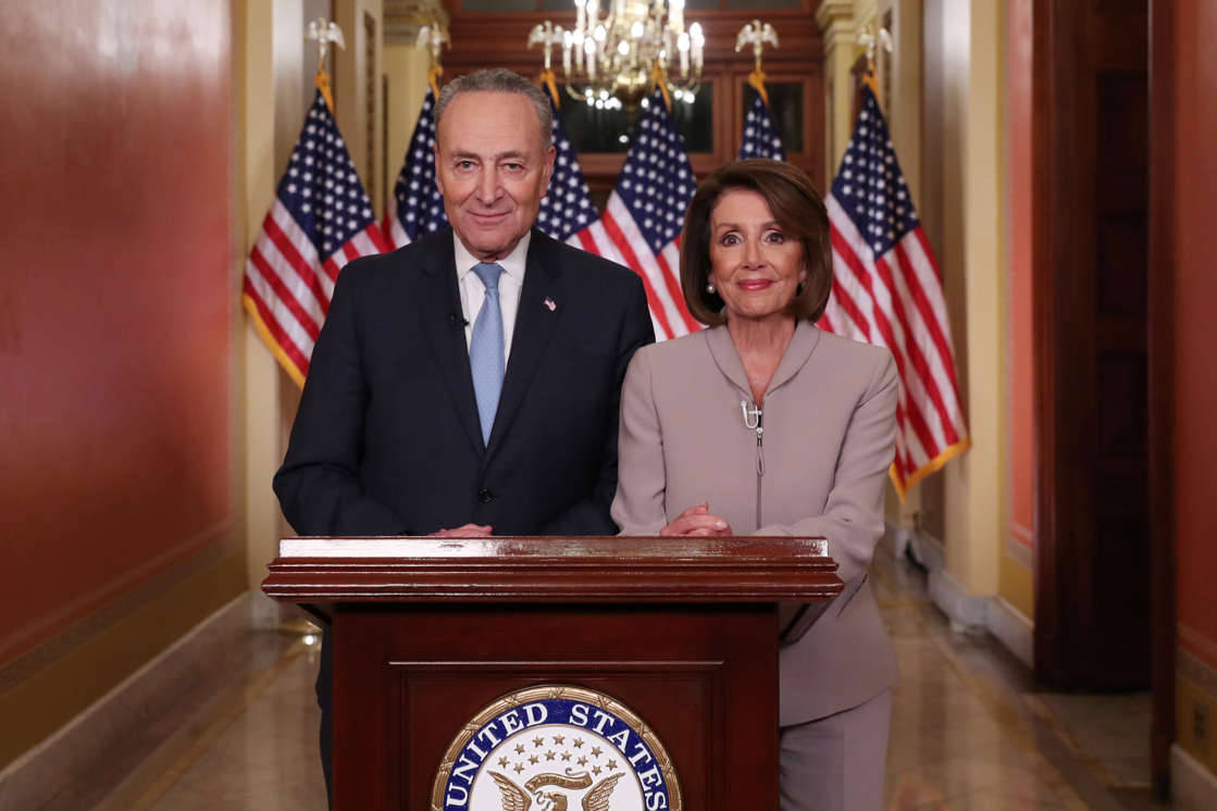 U.S. Speaker of the House Nancy Pelosi and Senate Minority Leader Chuck Schumer pose for photographers after concluding their joint response, to President Trump's prime time address, on Capitol Hill in Washington, U.S., January 8, 2019.  REUTERS/Jonathan Ernst