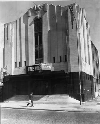 Slide 12 of 28: The Redesdale cinema with its imposing exterior is almost like an Art Deco version of a Gothic cathedral. It opened in 1933 as a cinema, closed in 1952 and became a dance hall, and then got turned into Sikh Temple in the 1970s.