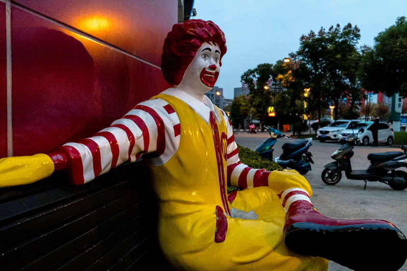 A c statue sits outside a McDonald's