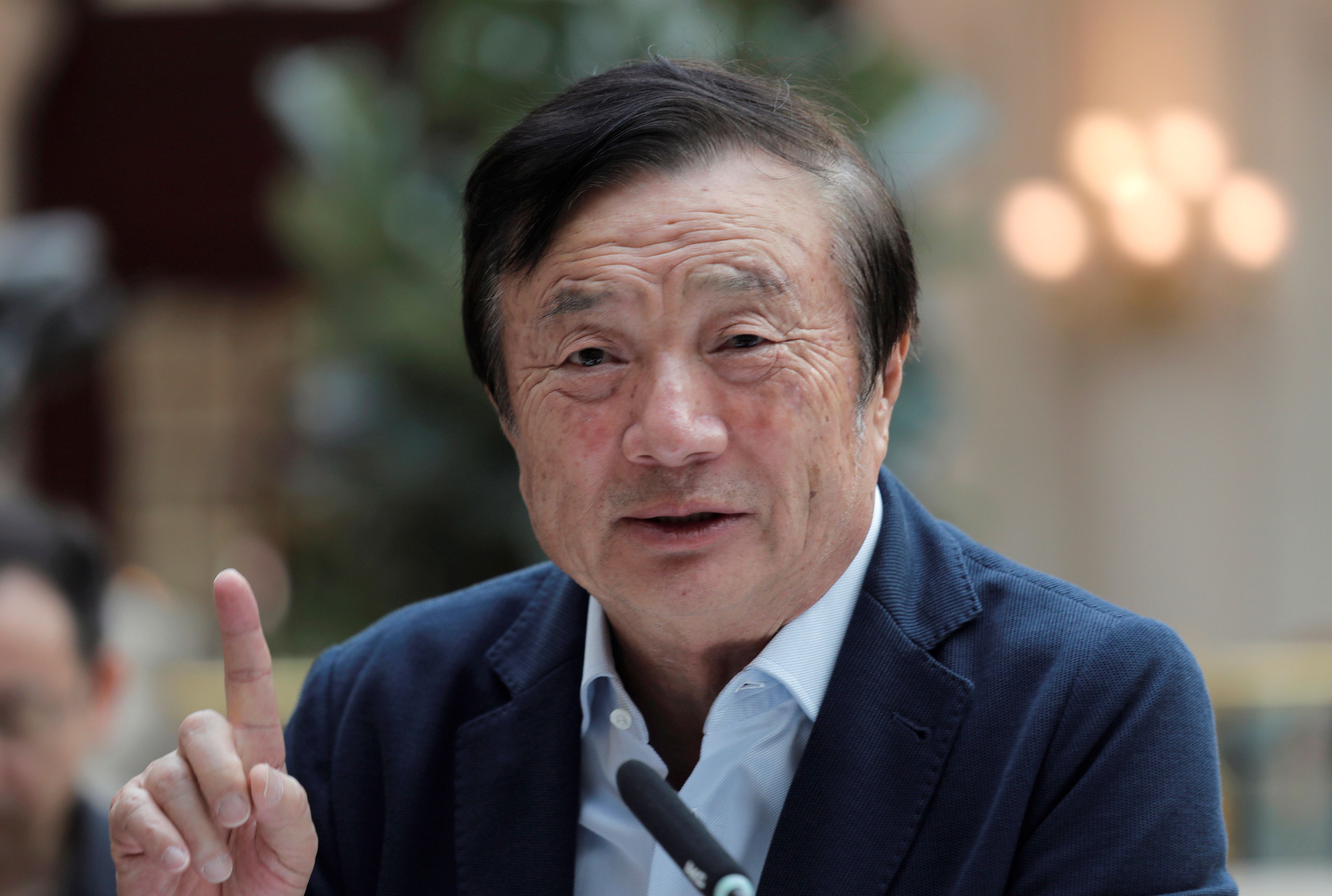 Ren Zhengfei, founder and CEO of Huawei, gestures during a round table meeting with the media in Shenzhen city, south China's Guangdong province, Tuesday, Jan. 15, 2019.