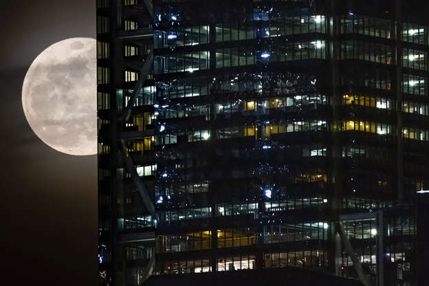 Slide 1 de 31: The full moon passes behind the World Trade Center in New York City, Tuesday, Feb. 19, 2019. (AP Photo/J. David Ake)