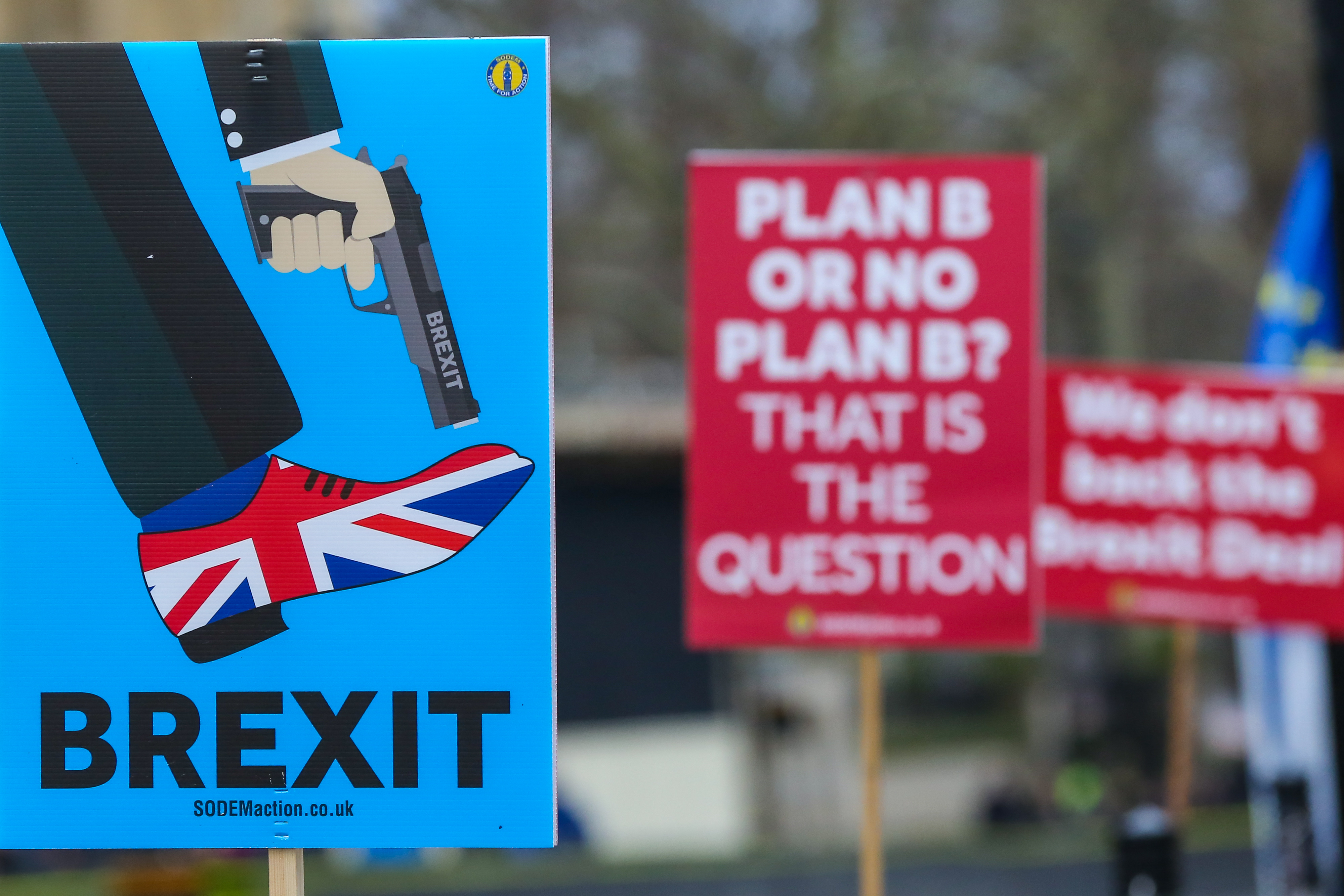 Anti-Brexit placards are seen during the demonstration outside Parliament
