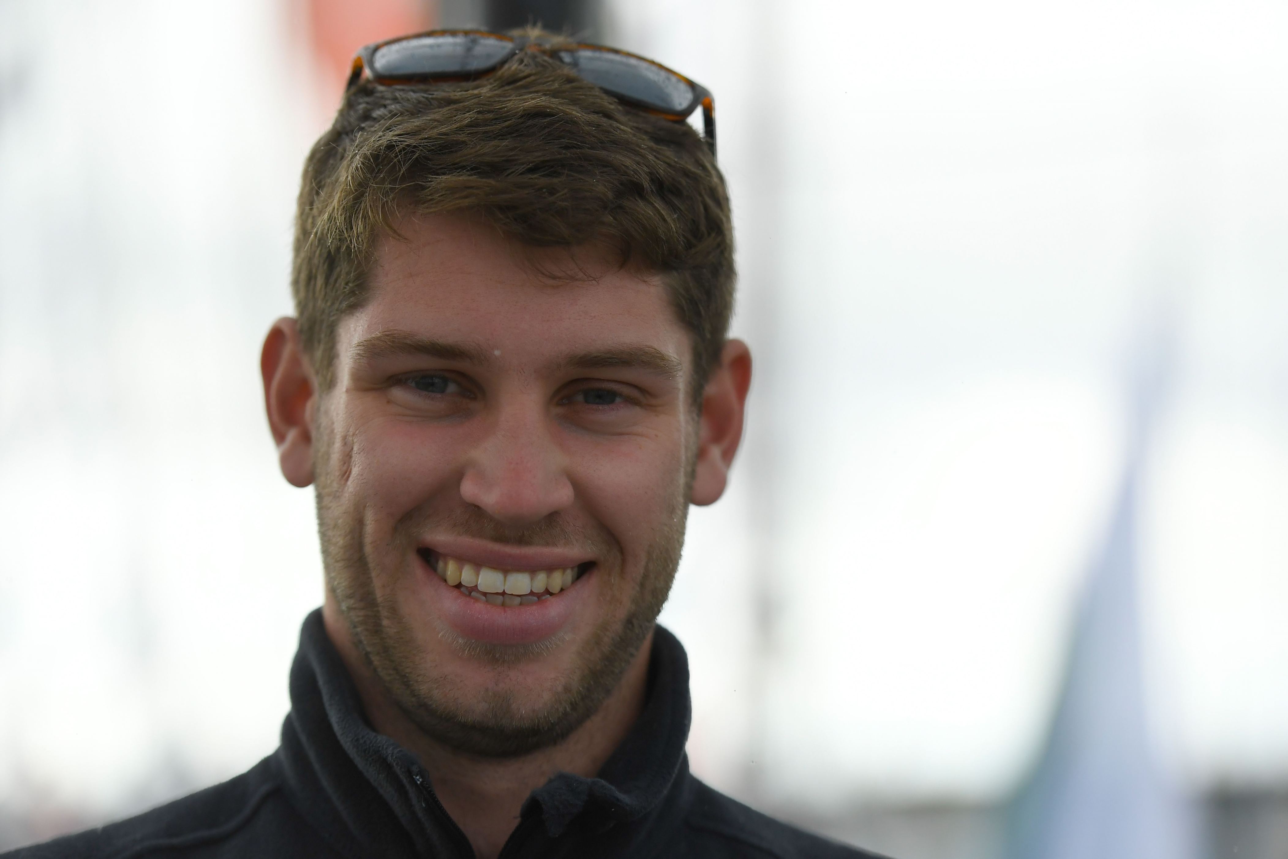 British skipper Jack Trigger poses on his Class 40 monohull Concise 8 in Saint-Malo, western France on November 1, 2018, a few days prior to the start of the Route du Rhum solo sailing race - Created in 1978, the Route du Rhum, a solo race held every four years between Saint-Malo to Pointe-a-Pitre, in the French West Indies, celebrates its 40th anniversary in 2018. (Photo by DAMIEN MEYER / AFP) (Photo credit should read DAMIEN MEYER/AFP/Getty Images)