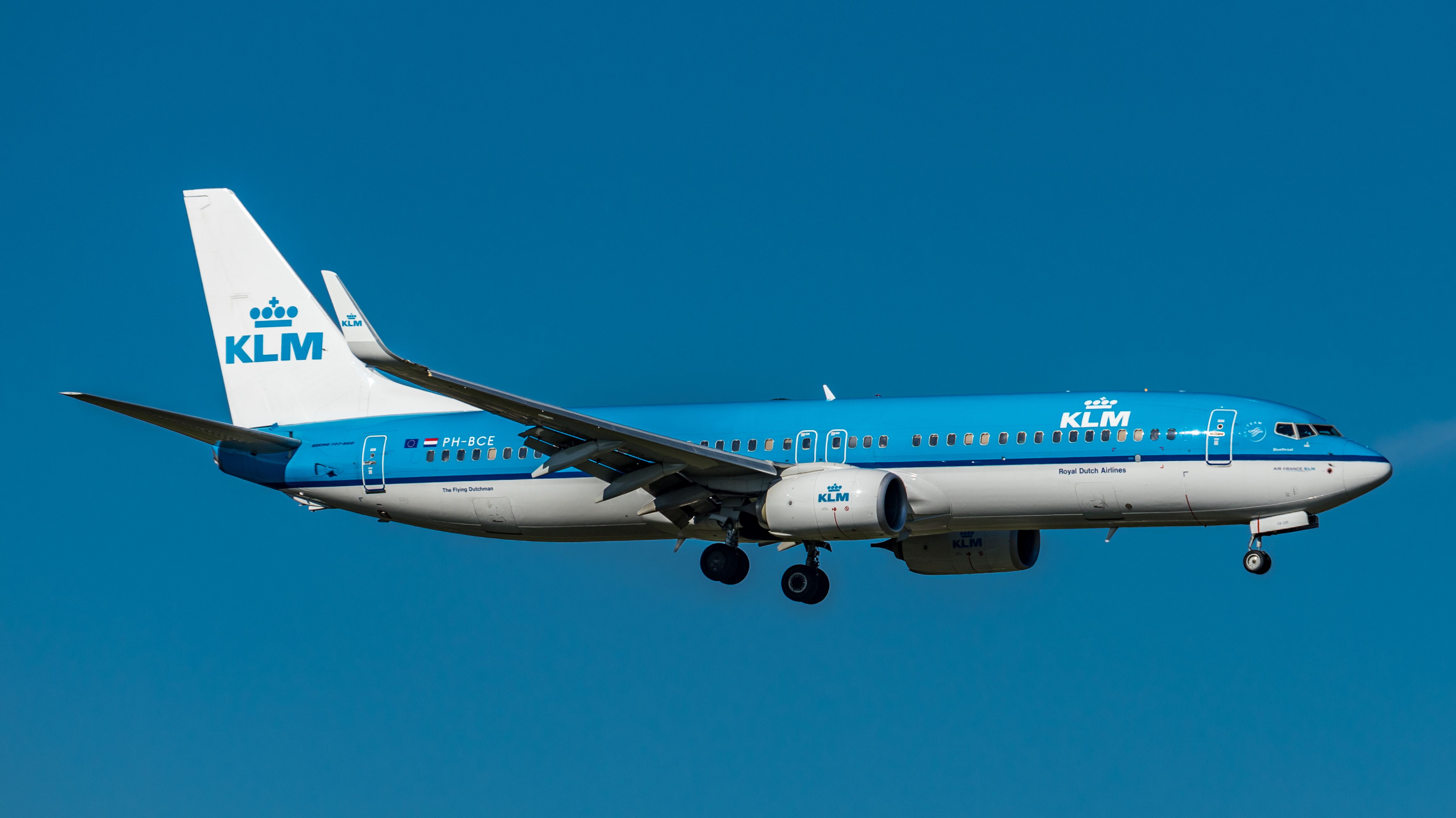 Zurich, Switzerland - September 8, 2018: A KLM Boeing 737-8K2 in sunny autumn weather landing on runway 14 of Zurich Airport. The aircraft registered PH-BCE was delivered to the Dutch airline on April 28, 2014. The photo was taken outside the airport.