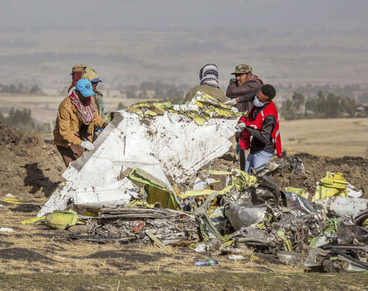 Slide 1 of 48: Rescuers work at the scene of an Ethiopian Airlines flight crash near Bishoftu, or Debre Zeit, south of Addis Ababa, Ethiopia, Monday, March 11, 2019.