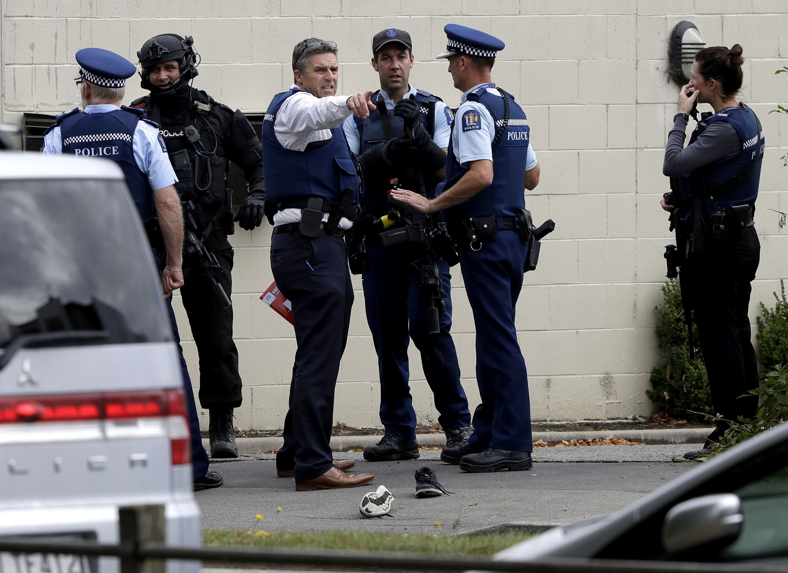 Police stand outside a mosque in central Christchurch, New Zealand, Friday, March 15, 2019. Multiple people were killed in mass shootings at two mosques full of people attending Friday prayers, as New Zealand police warned people to stay indoors as they tried to determine if more than one gunman was involved. (AP Photo/Mark Baker)