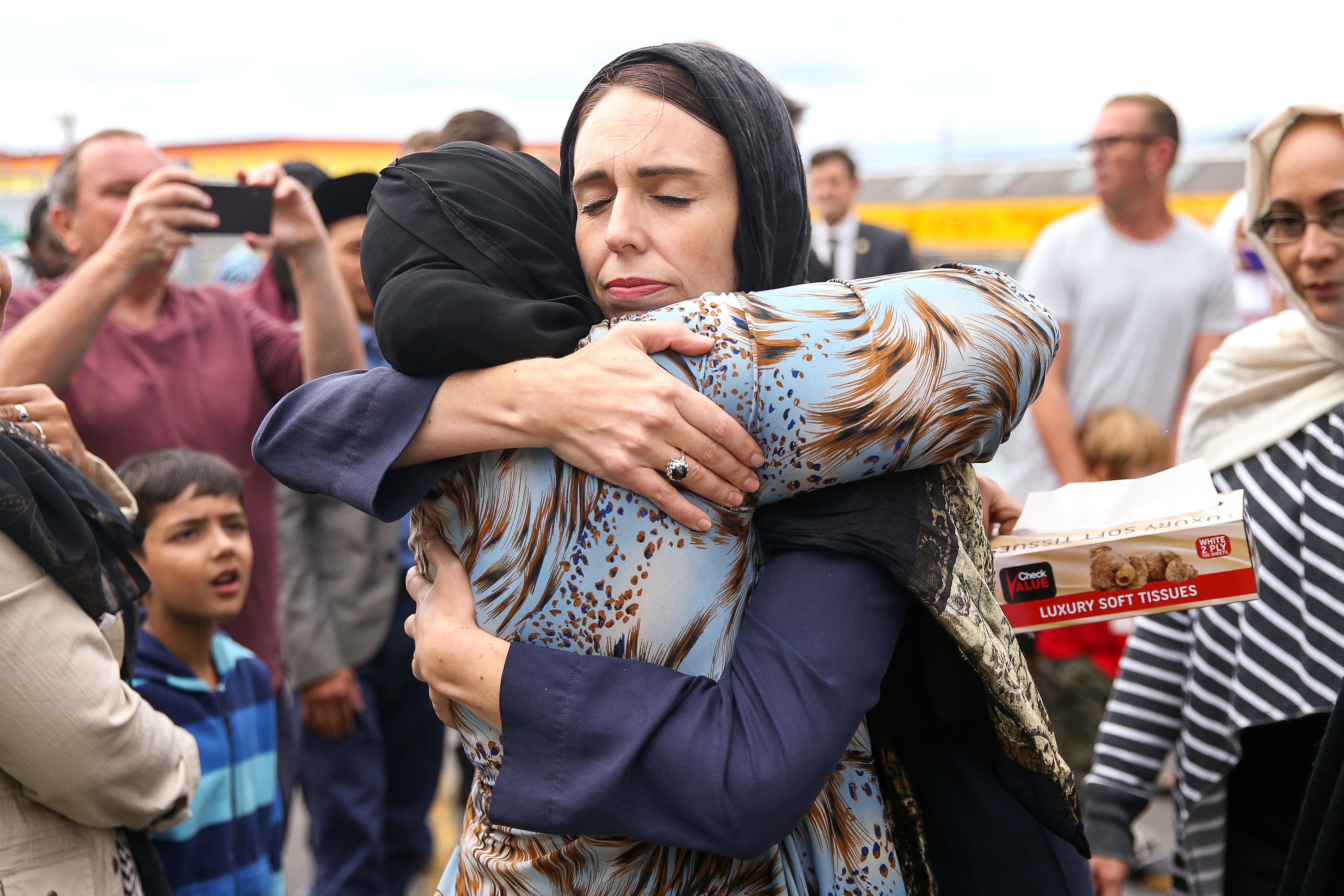 WELLINGTON, NEW ZEALAND - MARCH 17: Prime Minister Jacinda Ardern hugs a mosque-goer at the Kilbirnie Mosque on March 17, 2019 in Wellington, New Zealand. 50 people are confirmed dead and 36 are injured still in hospital following shooting attacks on two mosques in Christchurch on Friday, 15 March. The attack is the worst mass shooting in New Zealand's history. (Photo by Hagen Hopkins/Getty Images)