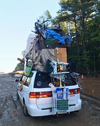 Slide 23 de 45: This June 28, 2017, photo provided by New Hampshire State Police trooper Nicholas Iannone shows a vehicle with household goods on its roof, including furniture, boxes and a wheeled basket after New Hampshire State Police pulled over on Interstate 93 near Londonderry, N.H. The agency is asking residents to limit the amount of luggage they place on top of their cars. (Nicholas Iannone/New Hampshire State Police via AP)