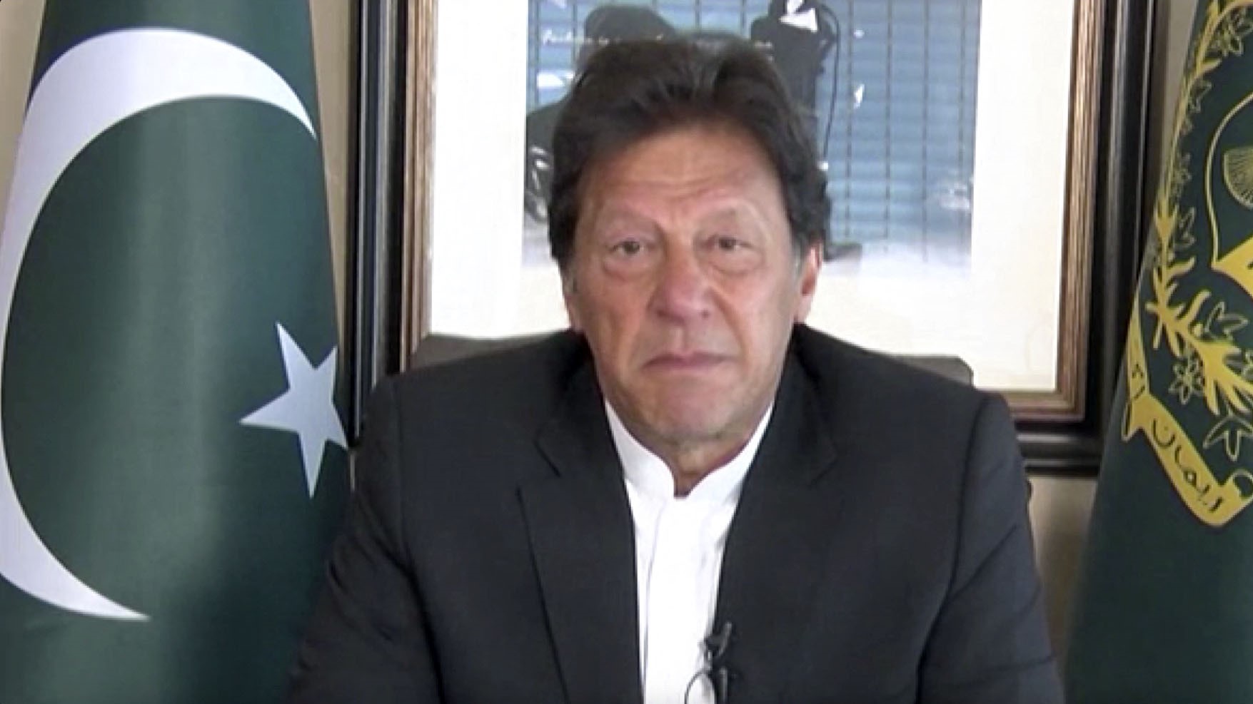 ISLAMABAD, PAKISTAN - FEBRUARY 27:  (----EDITORIAL USE ONLY  MANDATORY CREDIT - 'Pakistan Prime Ministry Office / Handout' - NO MARKETING NO ADVERTISING CAMPAIGNS - DISTRIBUTED AS A SERVICE TO CLIENTS----)   A screen grab captured from a video shows Prime Minister of Pakistan Imran Khan as he addresses to the nation on February 27, 2019. (Photo by Pakistan Prime Ministry Office / Handout/Anadolu Agency/Getty Images)