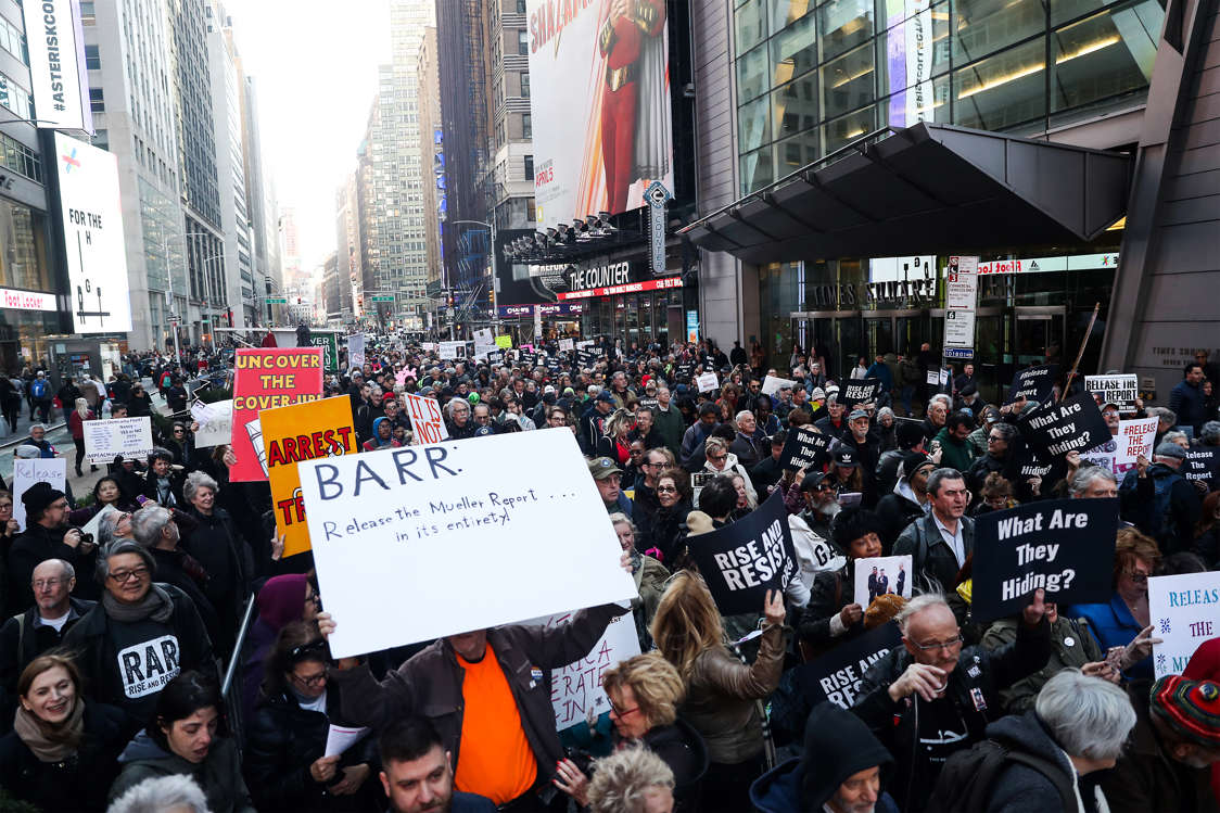 Slide 1 of 10: Hundreds of people hold banners and shout slogans against U.S. President Donald Trump and U.S. Vice President Mike Pence as they gather at Times Square during 'Release The Report' rally demanding for the release of the full Robert Mueller's report, on April 04, 2019 in New York, United States.