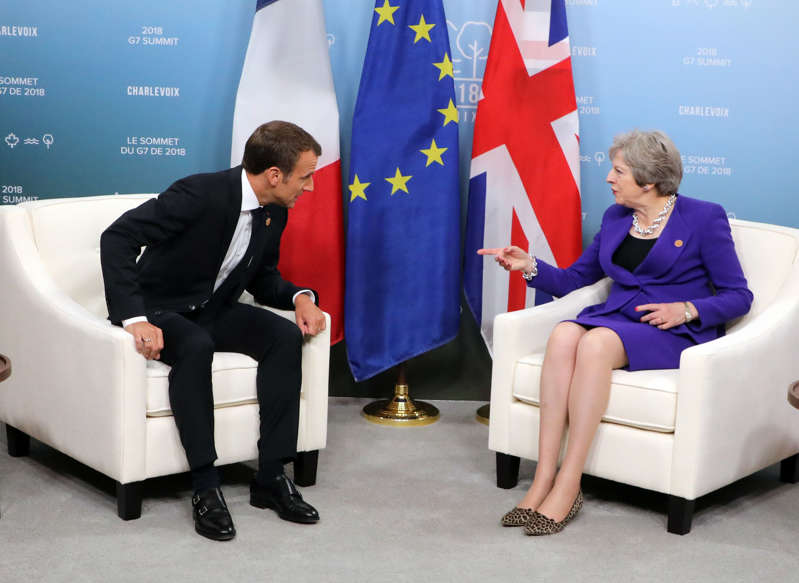French President Emmanuel Macron meets with British Prime Minister Theresa May during a bi-lateral meeting at the G7 summit in La Malbaie, Quebec, on June 8, 2018. (Photo by ludovic MARIN / AFP)        (Photo credit should read LUDOVIC MARIN/AFP/Getty Images)