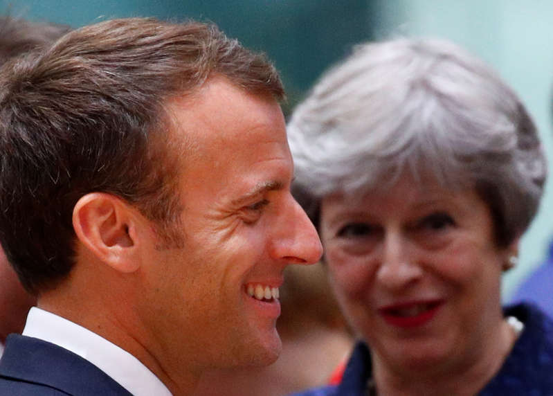 French President Emmanuel Macron and Britain's Prime Minister Theresa May attend an European Union leaders summit in Brussels, Belgium, June 28, 2018. REUTERS/Francois Lenoir