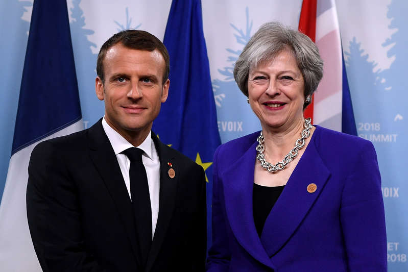 QUEBEC CITY, QC - JUNE 08:  French President Emmanuel Macron poses for a photo with British Prime Minister Theresa May during a bilateral meeting at Le Manoir Richelieu on day one of the G7 meeting on June 8, 2018 in Quebec City, Canada.  (Photo by Leon Neal/Getty Images)