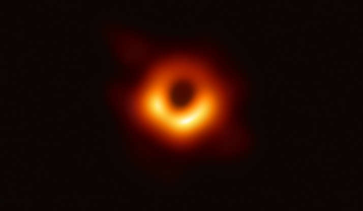 Slide 2 of 86: The first image ever produced of a black hole, taken by the Event Horizon Telescope on April 10, 2019 as observed at the center of Messier 87 in the Virgo galaxy cluster. The telescope was designed specifically to capture images of black holes, through a planet-scale array of eight ground-based radio telescopes around the world.