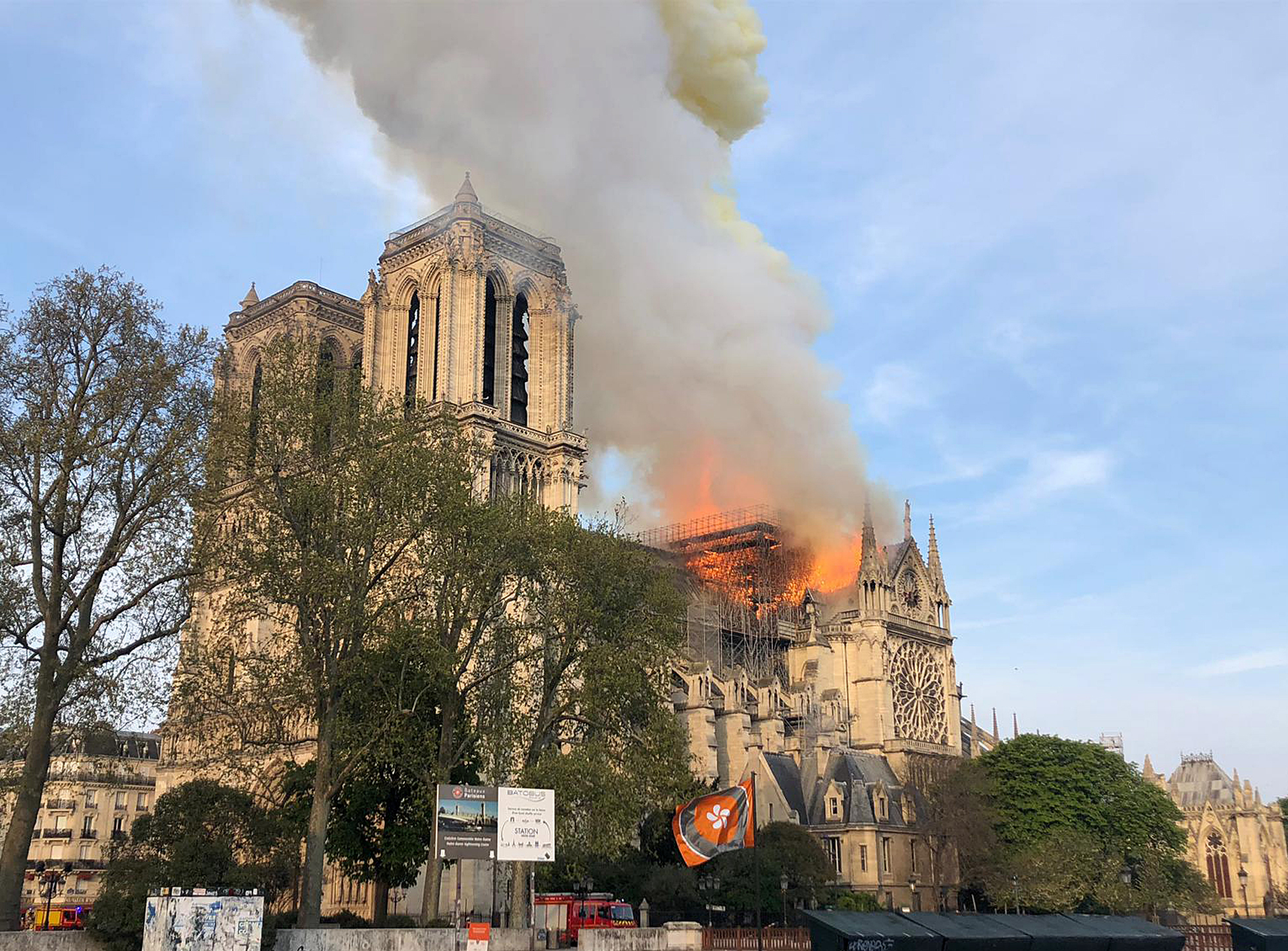 Notre Dame cathedral is burning in Paris, Monday, April 15, 2019. Massive plumes of yellow brown smoke is filling the air above Notre Dame Cathedral and ash is falling on tourists and others around the island that marks the center of Paris. (AP Photo)