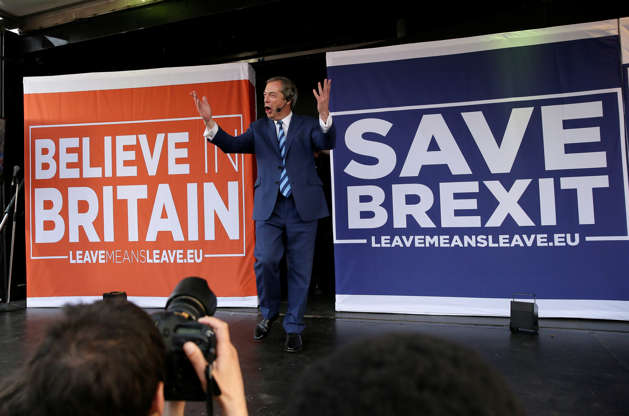 Slide 4 of 43: Former UKIP leader Nigel Farage arrives on stage to speak at a rally in Parliament Square after the final leg of the "March to Leave" in London, Friday, March 29, 2019. The protest march which started on March 16 in Sunderland, north east England, finishes on Friday March 29 in Parliament Square, London, on what was the original date for Brexit to happen before the recent extension. (AP Photo/Tim Ireland)