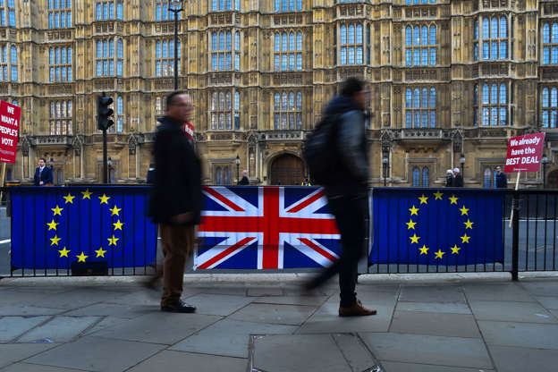 Slide 3 of 43: People walk past EU and Union flags, outside the Houses of Parliament, London on April 1, 2019. Chief Whip Julian Smith was critic with the Cabinet's post-election strategy. (Photo by Alberto Pezzali/NurPhoto via Getty Images)