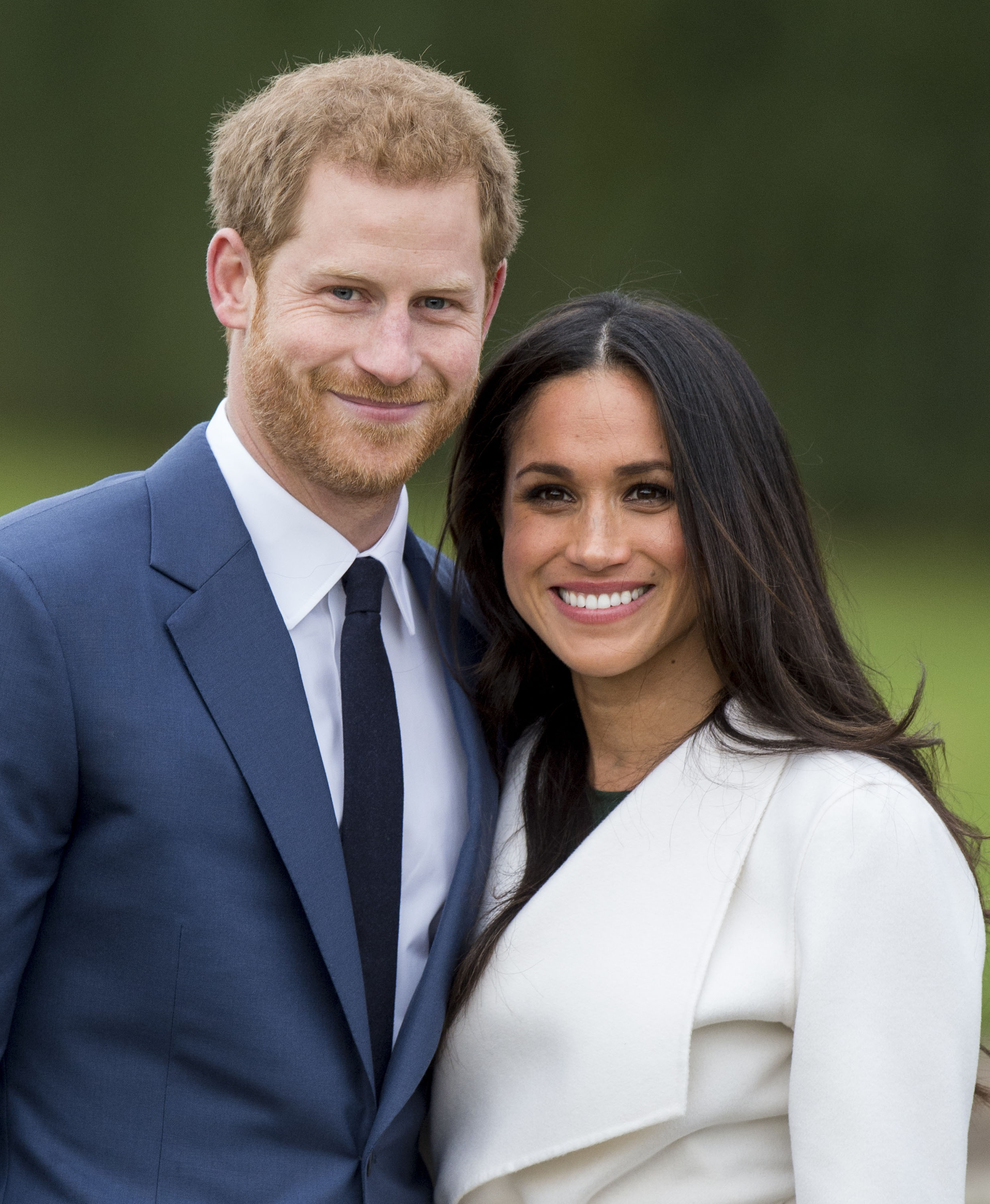 LONDON, ENGLAND - NOVEMBER 27:  Prince Harry and Meghan Markle during an official photocall to announce the engagement of Prince Harry and actress Meghan Markle at The Sunken Gardens at Kensington Palace on November 27, 2017 in London, England.  Prince Harry and Meghan Markle have been a couple officially since November 2016 and are due to marry in Spring 2018.  (Photo by Mark Cuthbert/UK Press via Getty Images)