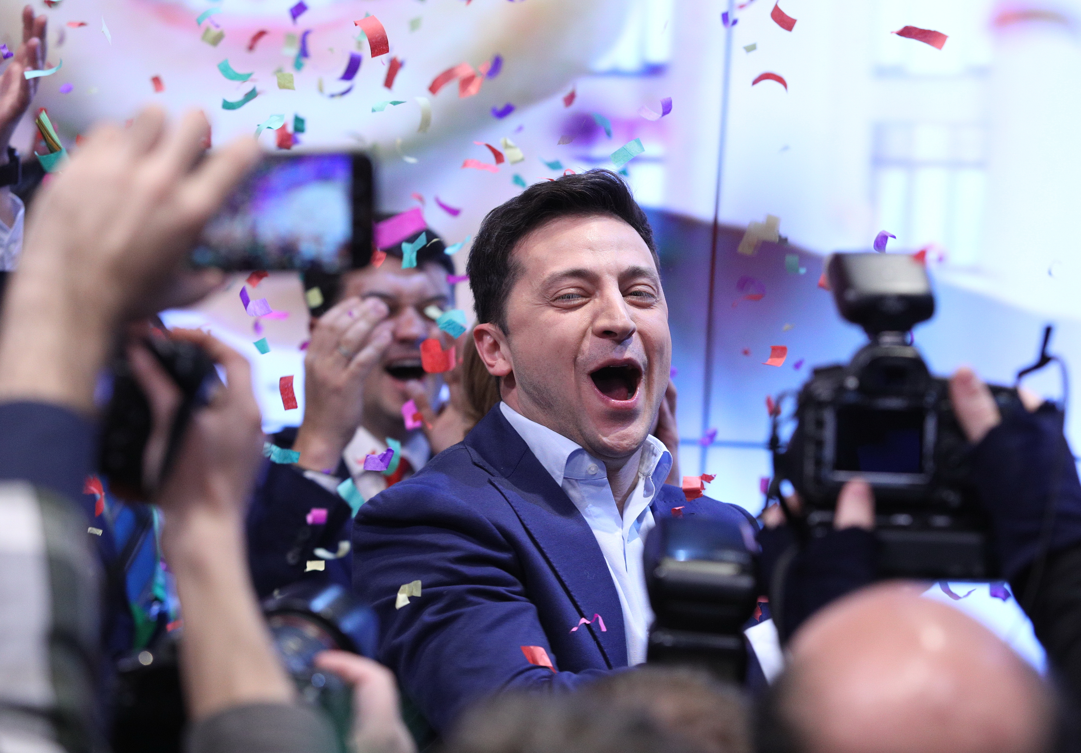 Ukrainian comedian and presidential candidate Volodymyr Zelenskiy smiles after the second round of presidential elections in Kiev, Ukraine, Sunday, April 21, 2019. Ukrainians voted on Sunday in a presidential runoff as the nation's incumbent leader struggles to fend off a strong challenge by a comedian who denounces corruption and plays the role of president in a TV sitcom. (Photo by Danil Shamkin/NurPhoto via Getty Images)