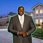 Shaquille O'Neal wearing a suit and tie standing in front of a building