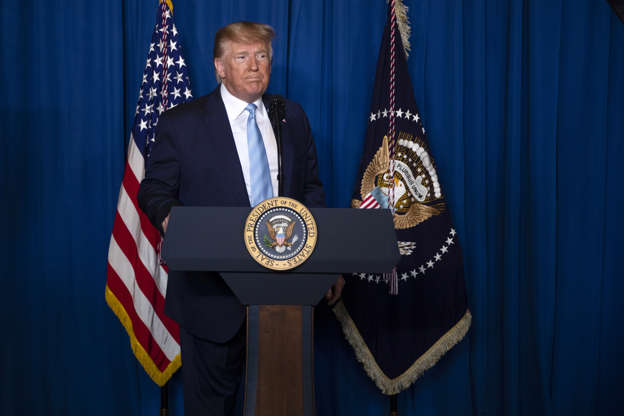 Slide 1 of 51: President Donald Trump arrives to deliver remarks on Iran, at his Mar-a-Lago property, Friday, Jan. 3, 2020, in Palm Beach, Fla.