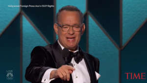 Tom Hanks wearing a suit and tie