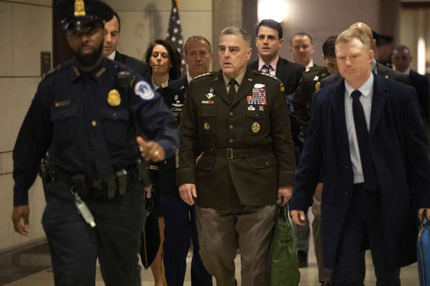 Slide 1 of 55: Joint Chiefs of Staff Chairman Gen. Mark Milley, center, walks towards the Senate after briefing members of Congress on last week's targeted killing of Iran's senior military commander Gen. Qassem Soleimani, Wednesday, Jan. 8, 2020, on Capitol Hill in Washington.