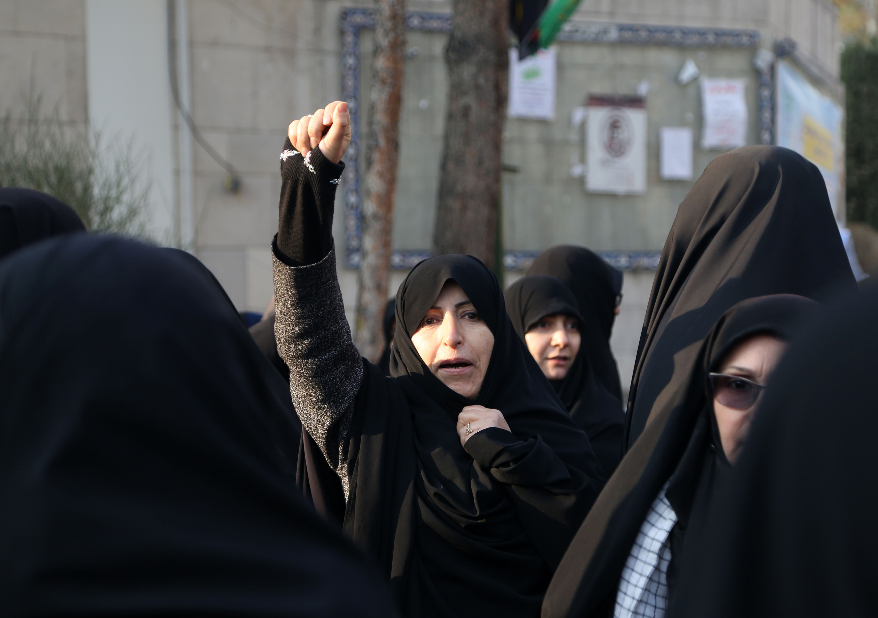 Slide 1 of 50: A group of Iranians protest United Kingdom and United States during a vigil held for the victims of the airplane of Ukrainian International Airlines that crashed near Imam Khomeini Airport and Qasem Soleimani, commander of Iranian Revolutionary Guards' Quds Forces, who was killed in a U.S. airstrike in Iraq at Tehran University in Tehran, Iran on January 14, 2020.