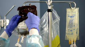 A nurse hangs the chemotherapy medicine for a patient at MedStar Georgetown University Hospital.
