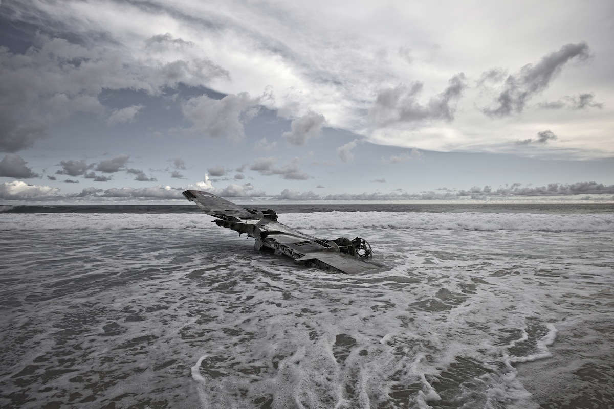 Slide 3 of 28: Eckell discovered the wreck in 2010, six years after the crash. A storm was passing by the day he shot the wreck. Result was the stunning photograph of the plane with heavily overcast sky.
