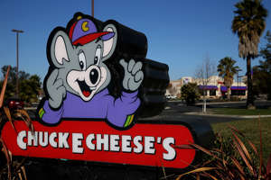NEWARK, CA - JANUARY 16:  A sign is posted in front of a Chuck E. Cheese restaurant on January 16, 2014 in Newark, California. CEC Entertainment, operator of 577 kid-themed restaurants, announced today that it has agreed to be purchased by private equity firm Apollo Global Management for $1.3 billion.  (Photo by Justin Sullivan/Getty Images)