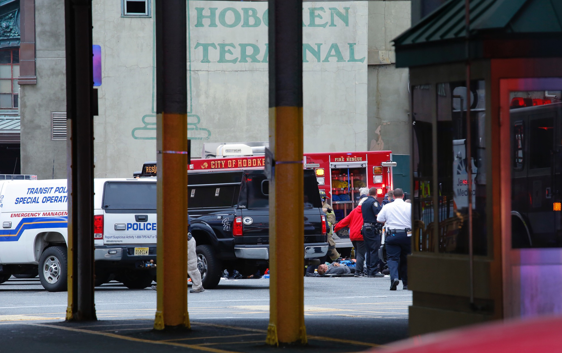 Emergency workers give aid to an injured person at New Jersey Transit's rail station in Hoboken, New Jersey September 29, 2016.
A commuter train crashed into a station in New Jersey during the morning rush hour on Thursday, officials said, with dozens of