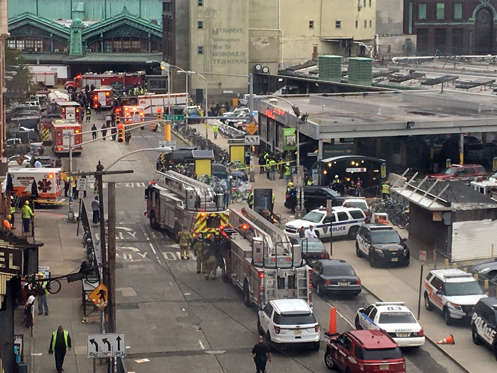 Emergency personnel arrive at the scene of a train crash in Hoboken, N.J. on Thursday, Sept. 29, 2016. A commuter train barreled into the New Jersey rail station during the Thursday morning rush hour, causing serious damage. (AP Photo/Joe Epstein)