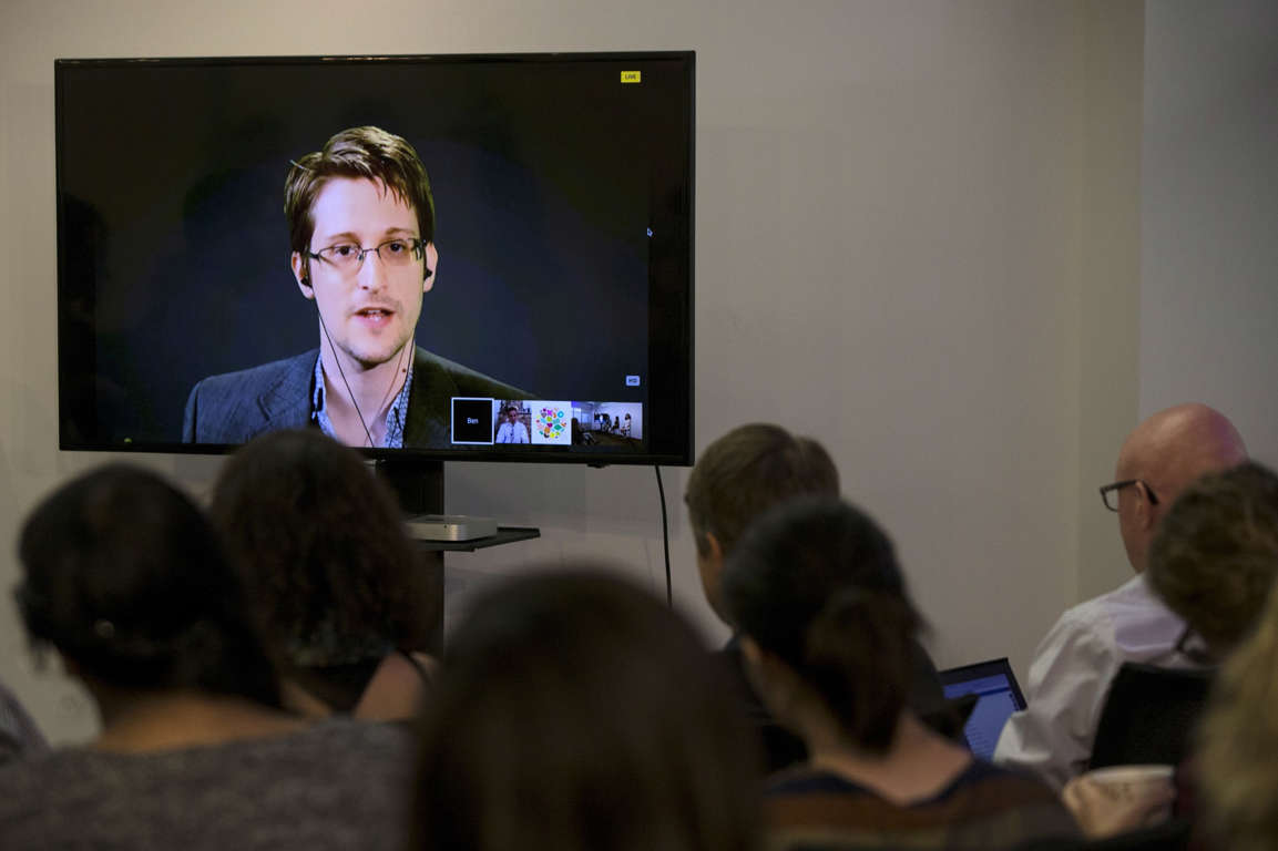 In this file photo, American whistleblower Edward Snowden delivers remarks via video link from Moscow to attendees at a discussion regarding an International Treaty on the Right to Privacy, Protection Against Improper Surveillance and Protection of Whistleblowers in New York City on Sept. 24, 2015.
