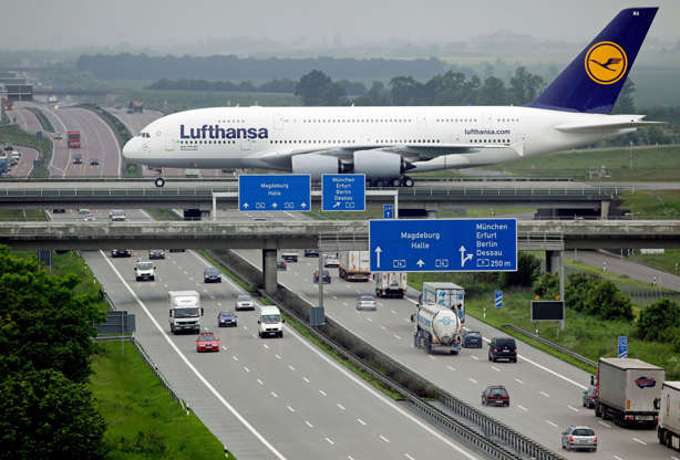 Slide 6 of 14: An Airbus A380 of German airline Lufthansa rolls over a bridge after it landed at the airport in Schkeuditz near Leipzig in eastern Germany on June 1, 2010. The German national football team will use an A380 when they travel on June 6, 2010 to South Afri
