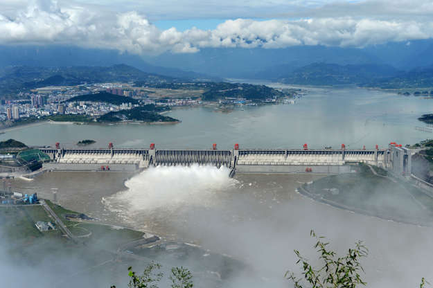 Slide 1 of 14: YICHANG, HUBEI PROVINCE - SEPTEMBER 19:  (CHINA OUT) Flood water is released from spillways of the Three Gorges Dam on September 19, 2014 in Yichang, Hubei Province of China. The second flood peak, caused by heavy downpours in the upper reaches of the Ya