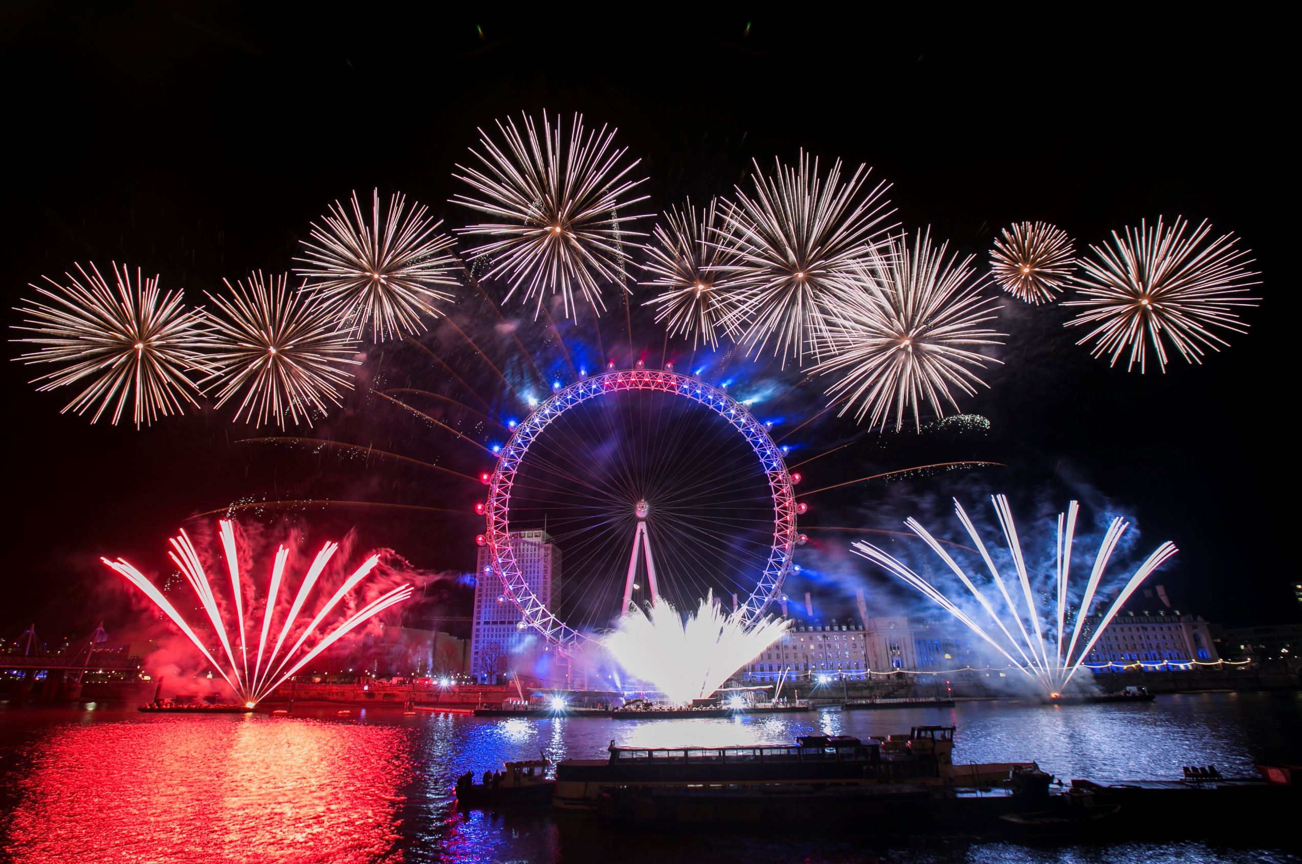 LONDON, ENGLAND - DECEMBER 31: Unicef wishes London a #HappyBlueYear by adding a hint of blue to the iconic New Year's Eve firework display to support their 'New Year's Resolutions for Children' campaign on December 31, 2015 in London, England. Text MOUTH to 70444 to donate £3. (Photo by John Phillips/Getty Images for Unicef)