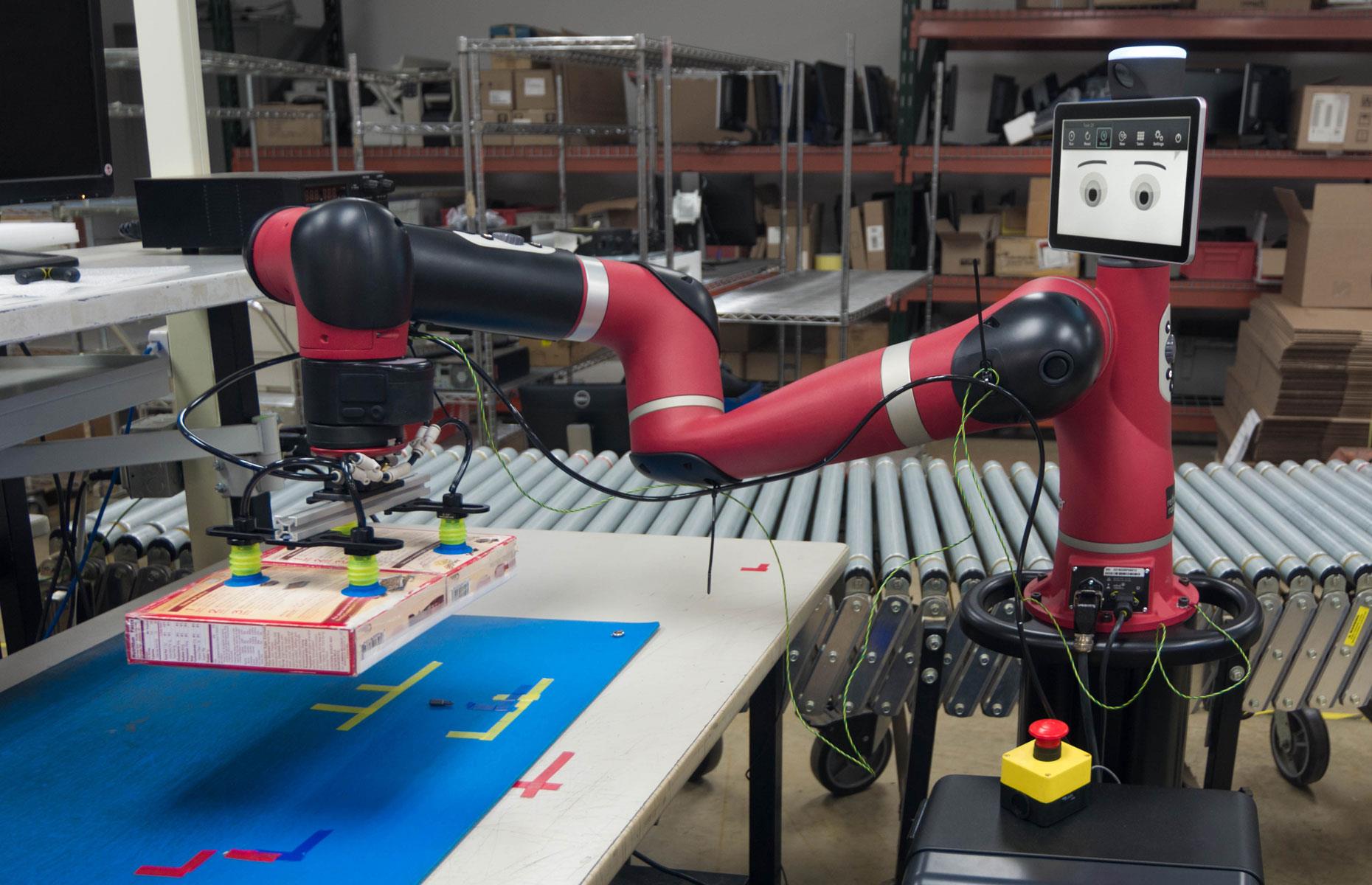 Diapositiva 3 de 31: DHL has also started to use collaborative robots. The logistics leviathan is trialing two Rethink Robotics cobots called Baxter and Sawyer at its warehouses in the States. The smart cobots perform packing, kitting and pre-retail tasks alongside their human colleagues.