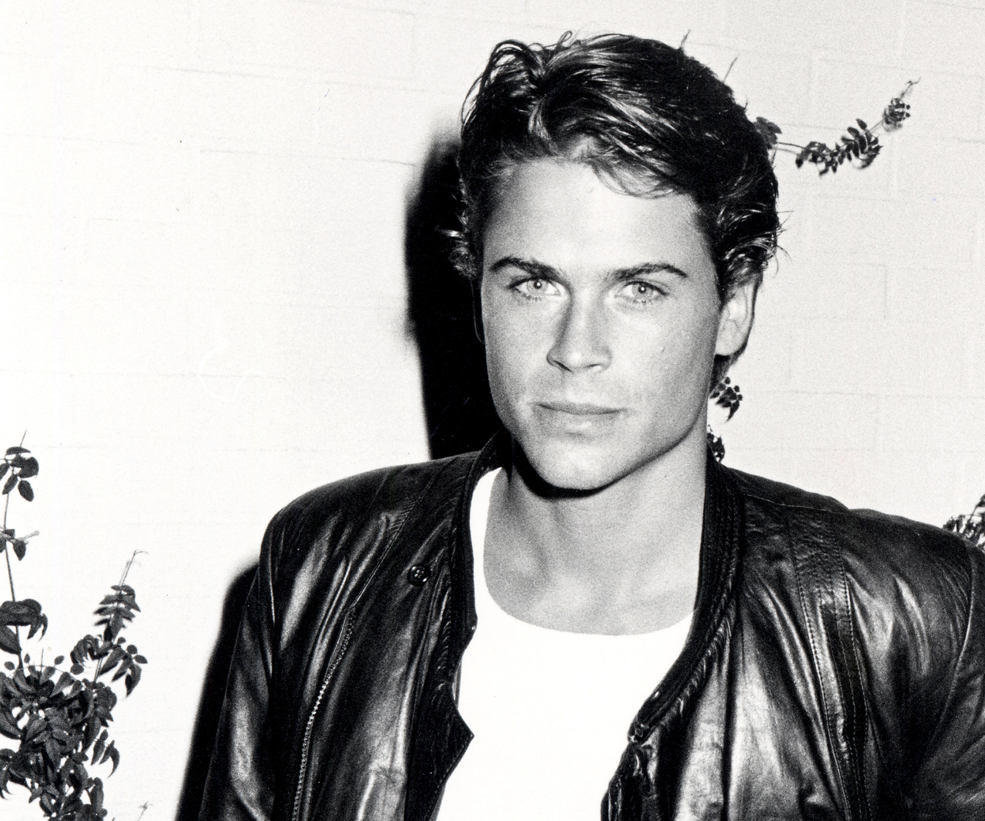 Slajd 55 z 86: Rob Lowe standing in convertible in publicity portrait for the film 'Oxford Blues', 1984.