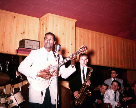 Slide 3 of 14: CIRCA 1956:  Rock and roll musician Chuck Berry plays electric guitar as he performs with his band in circa 1956. (Photo by Michael Ochs Archives/Getty Images)